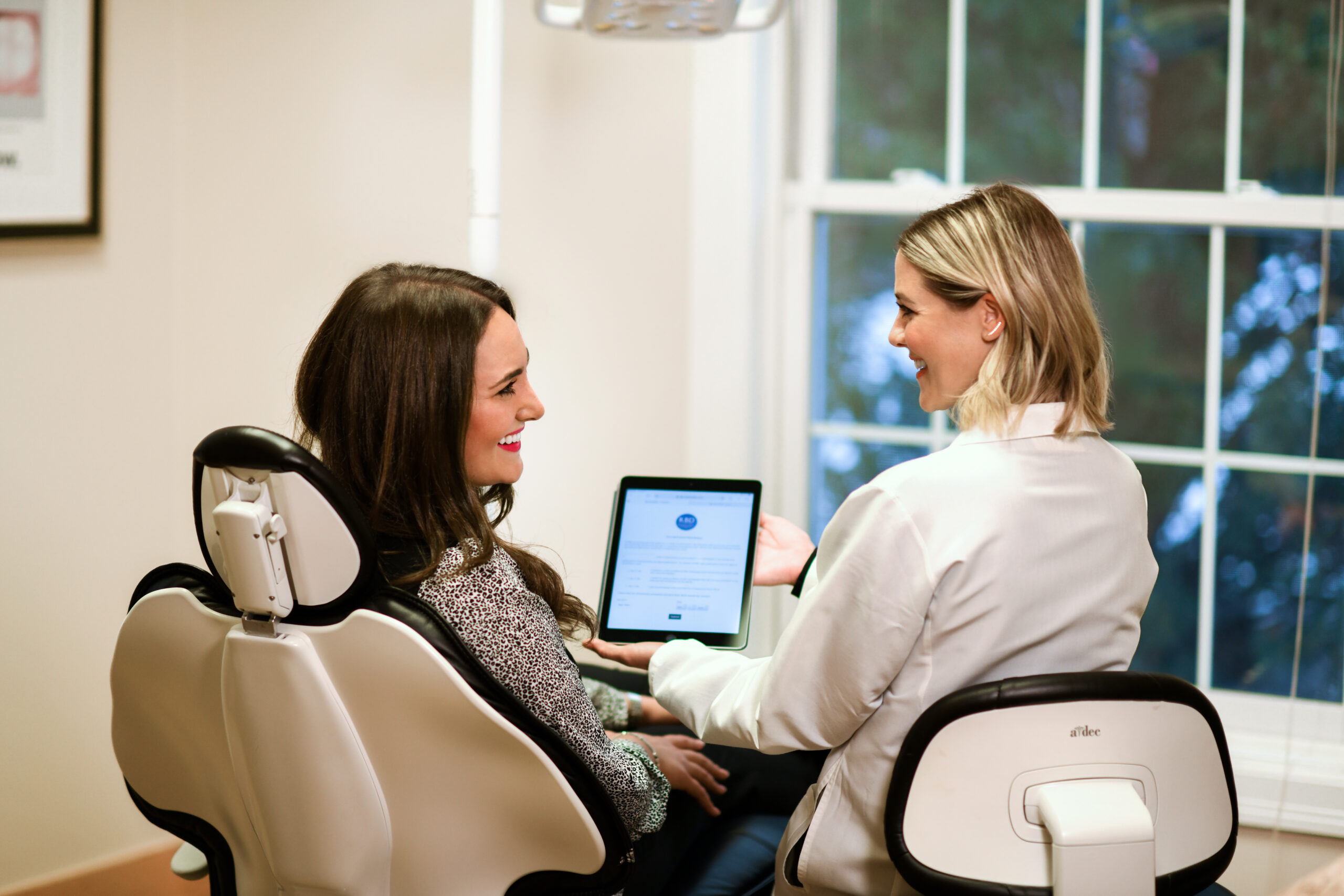 Dental Hygienist working with a patient in the dental chair